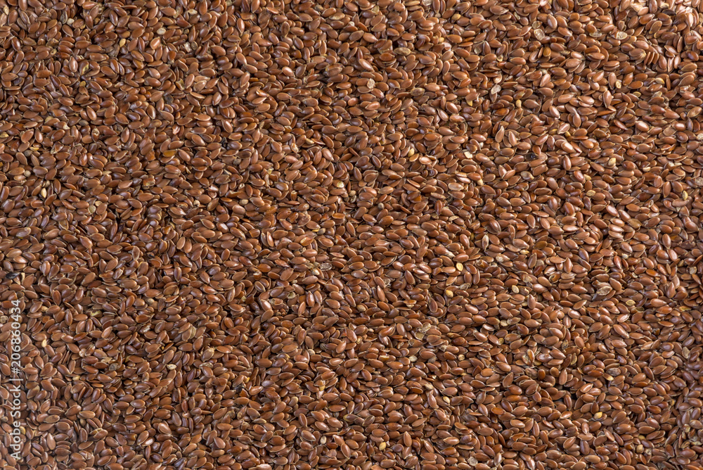 Flax seeds in the form of background. Healthy diet with omega 3 fatty acids. Flax seeds in the form of background. Healthy diet with omega 3 fatty acids.