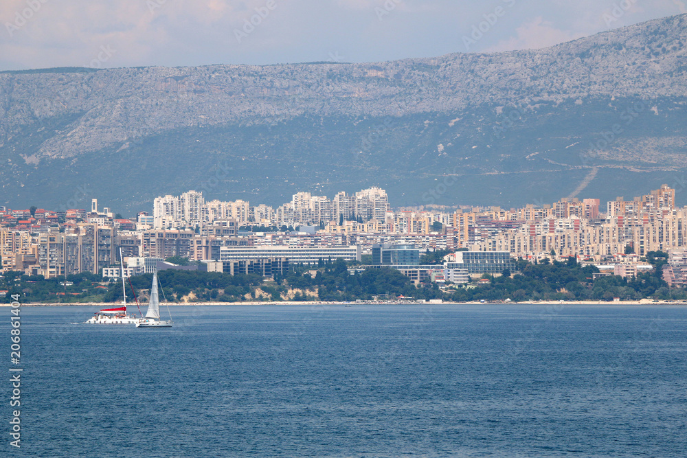 Sailing boats in front of city coast in Split, Croatia. 