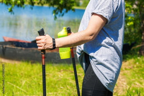 Woman doing Nordic walking in park