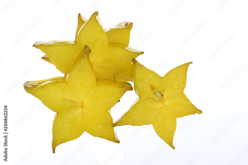 heap of slices of yellow starfruit (carambola) isolated heap of slices of yellow starfruit (carambola) isolated