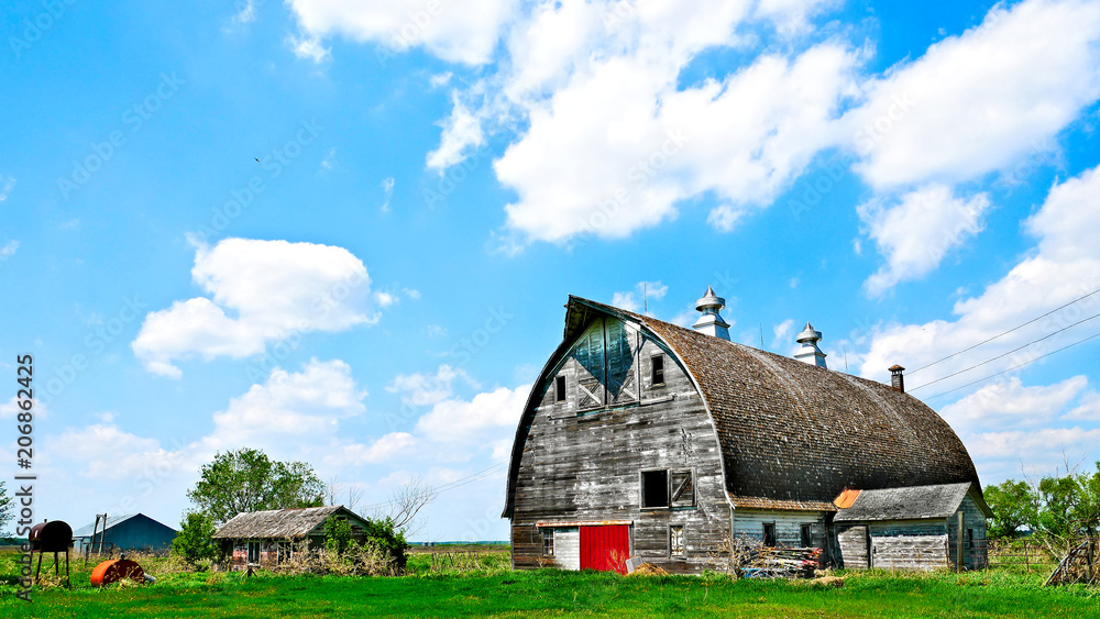 An old abandoned barn sits decaying on an empty farm in northern Minnesota. An old abandoned barn sits decaying on an empty farm in northern Minnesota.