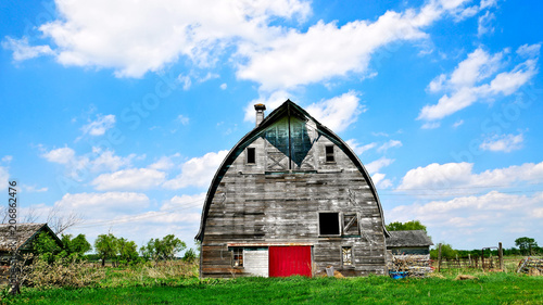 An old abandoned barn sits decaying on an empty farm in northern Minnesota. photo