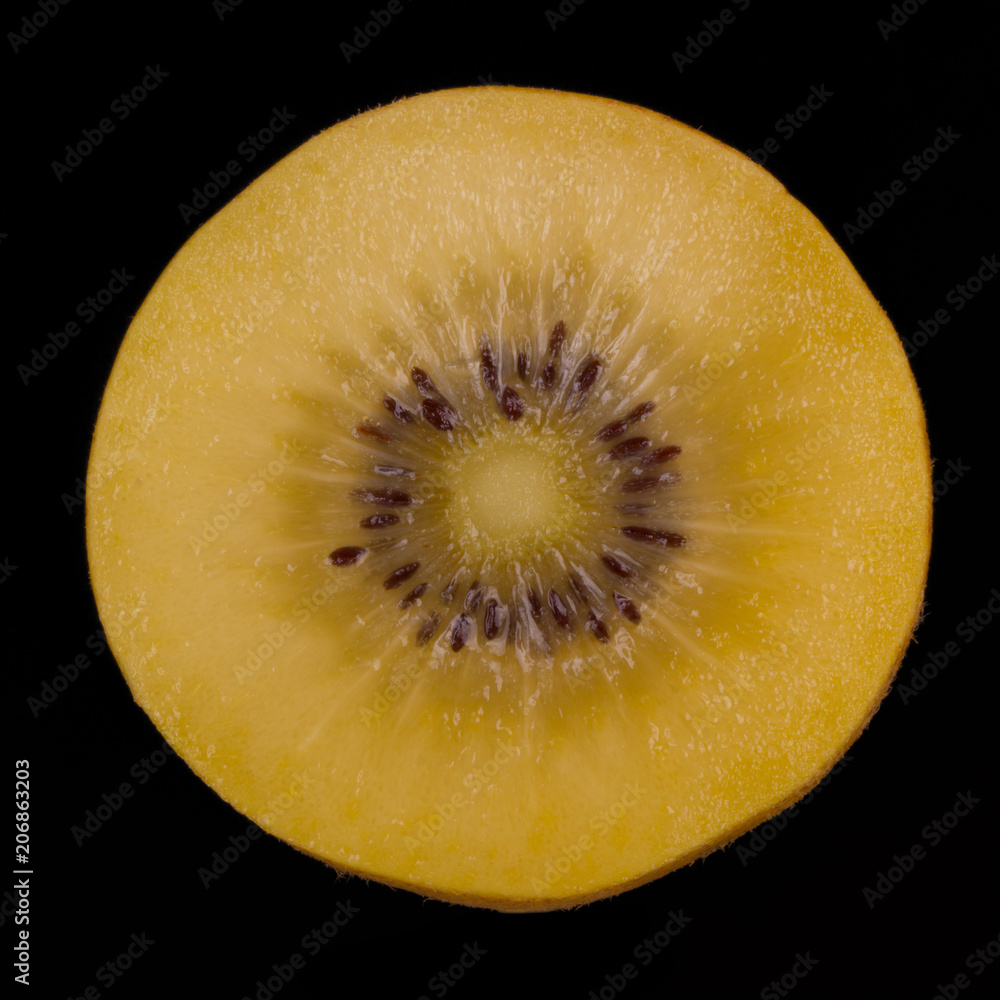 half of kiwi gold isolated on black background. front view