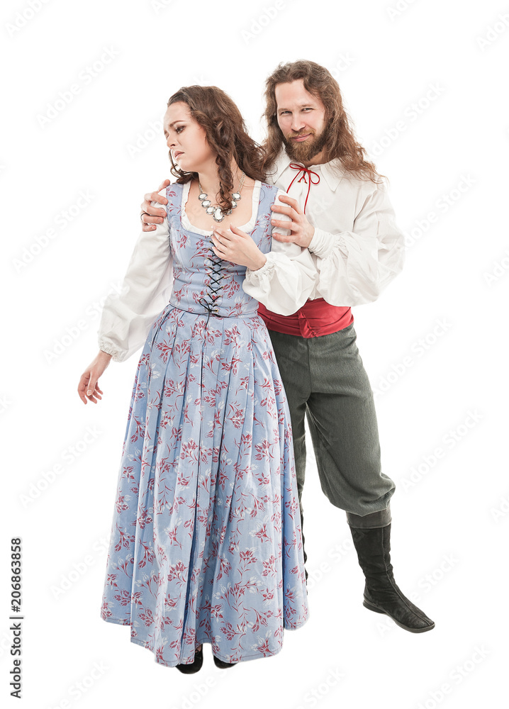 Beautiful couple woman and man in medieval clothes isolated Beautiful couple woman and man in medieval clothes isolated