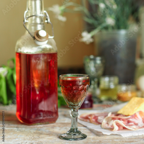 alcohol drink in a glass on a wooden table (wine) - drink berry cuisine. Food background