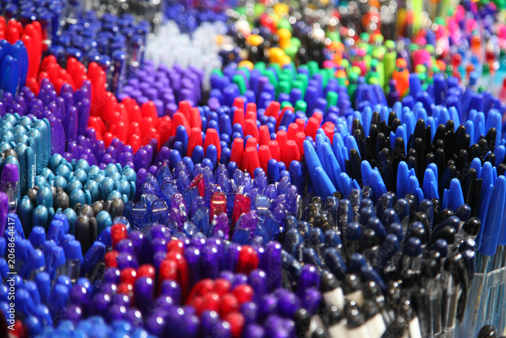 Obraz premium Automatic ballpoint pen. School supplies, stationery accessories. Colorful stationery. Stationery store. Goods for office and study.