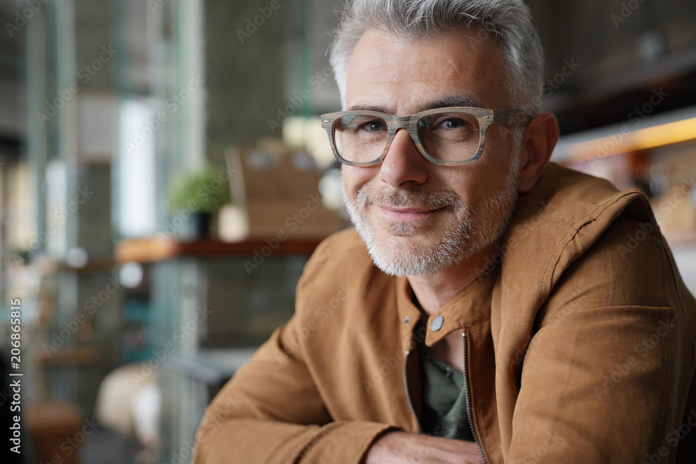 Portrait of smiling middle-aged man with eyeglasses Portrait of smiling middle-aged man with eyeglasses