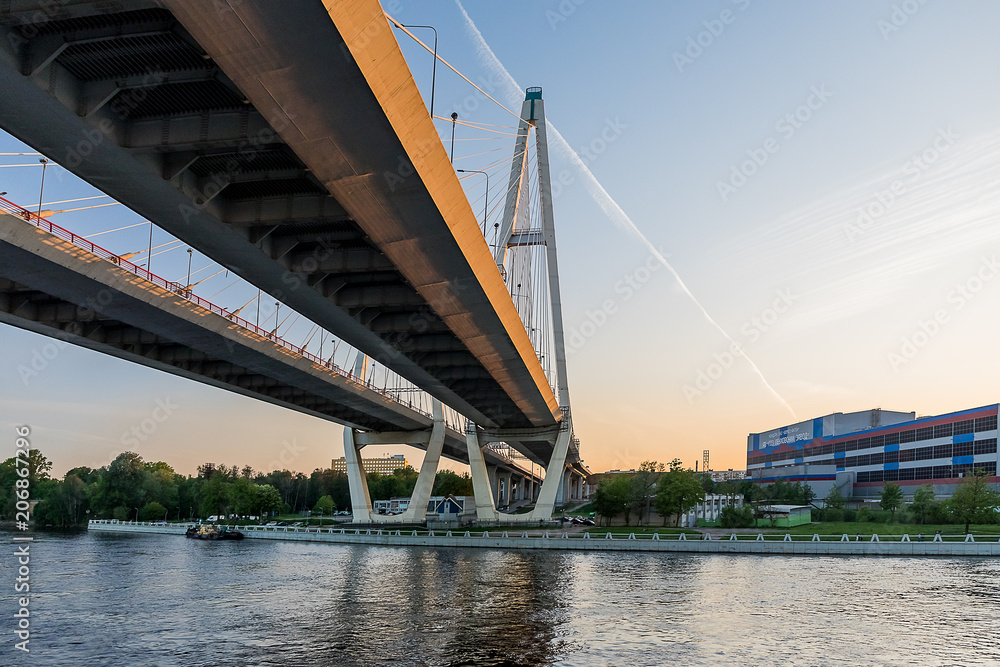 Fototapeta premium Cable-stayed bridge on the Neva river in St. Petersburg in the sunset.
