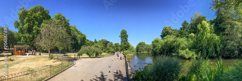 LONDON - JUNE 2015: People enjoy Hyde Park in summer season. London attracts 20 million tourists annually