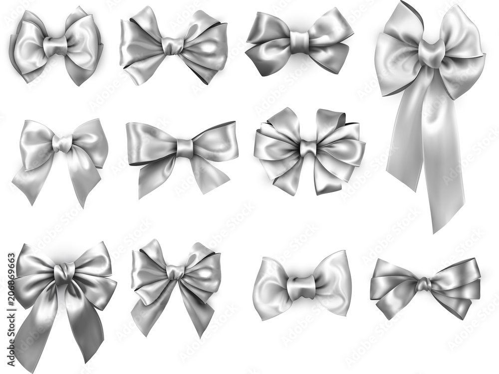 Silver realistic satin bows isolated on white.