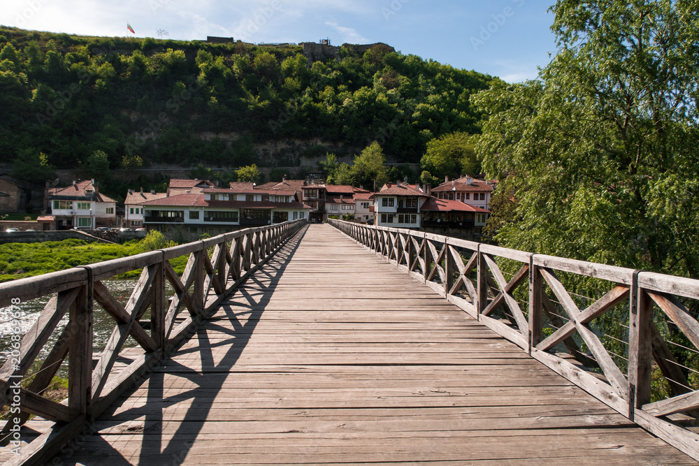 Old wooden bridge - famous landmark of Veliko Tarnovo, old capital of Bulgaria. Photo was taken at sunny spring day.