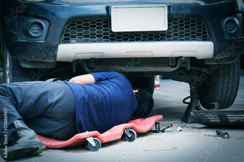 Technician checking engine of car. Auto mechanic checking car engine. Maintenance checking car.