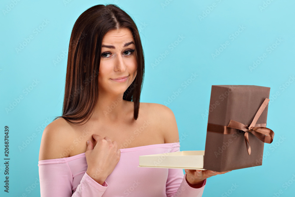 Fototapeta premium Woman against blue wall background