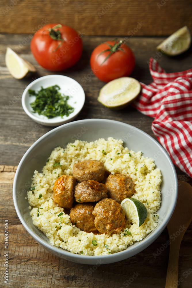 Spice meatballs with vegetable sauce and couscous