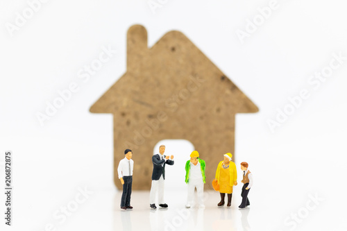 Miniature people hiring contractor interior decoration for house. Image use for Building a house.