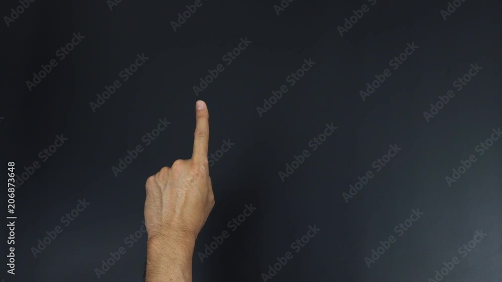 One number hand gesture on black background One number hand gesture on black background