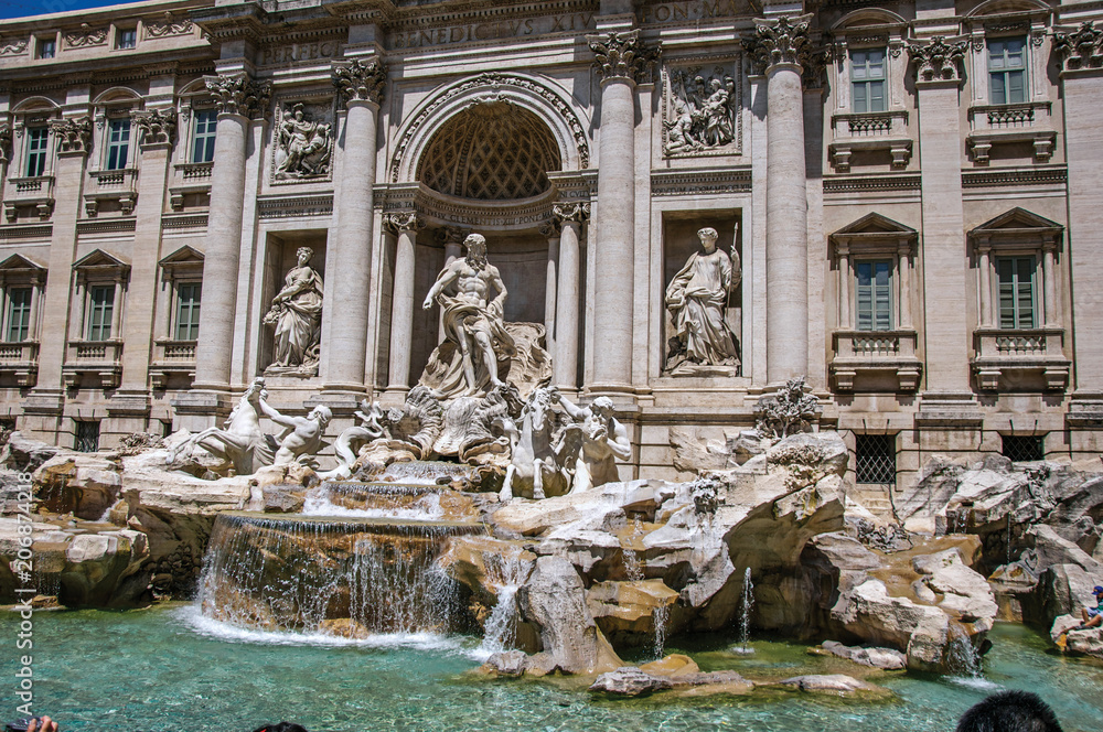 Overview of the world-famous Trevi Fountain in sunny day at the city center of Rome, the incredible city of the Ancient Era, known as 