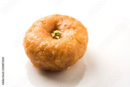 Balushahi sweet food served in a white or golden plate over moody background