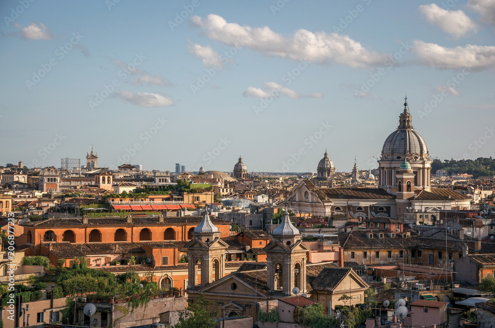 Overview cathedrals domes and roofs of buildings in the sunset of Rome, the incredible city of the Ancient Era, known as 