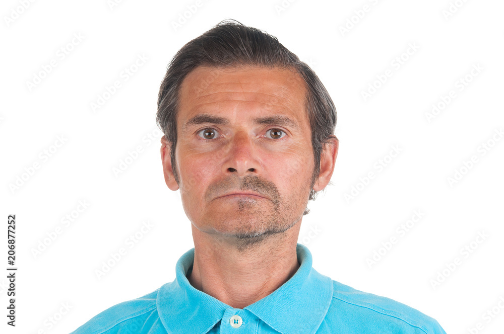 Portrait of adult man with half shaved face in blue shirt on white background Portrait of adult man with half shaved face in blue shirt on white background