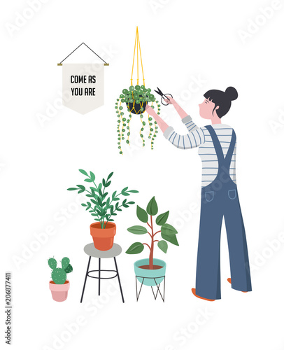 Urban jungle, trendy home decor with plants, planters, cacti, tropical leaves