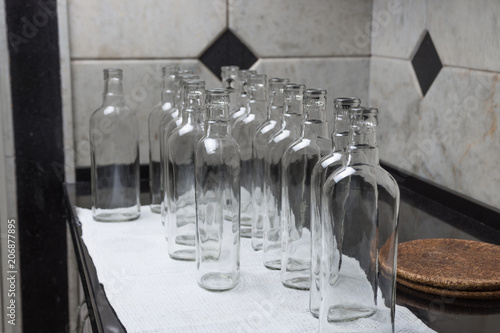 Empty glass bottles at kitchen to fill with drink