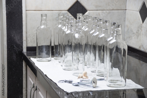 Empty glass bottles at kitchen to fill with drink