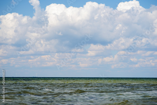 the blue ocean with dull clouds on a lovely sunny day