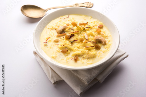 Rice pudding OR Kheer from India called also called Firnee. served in a bowl. Selective focus