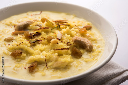 Rice pudding OR Kheer from India called also called Firnee. served in a bowl. Selective focus