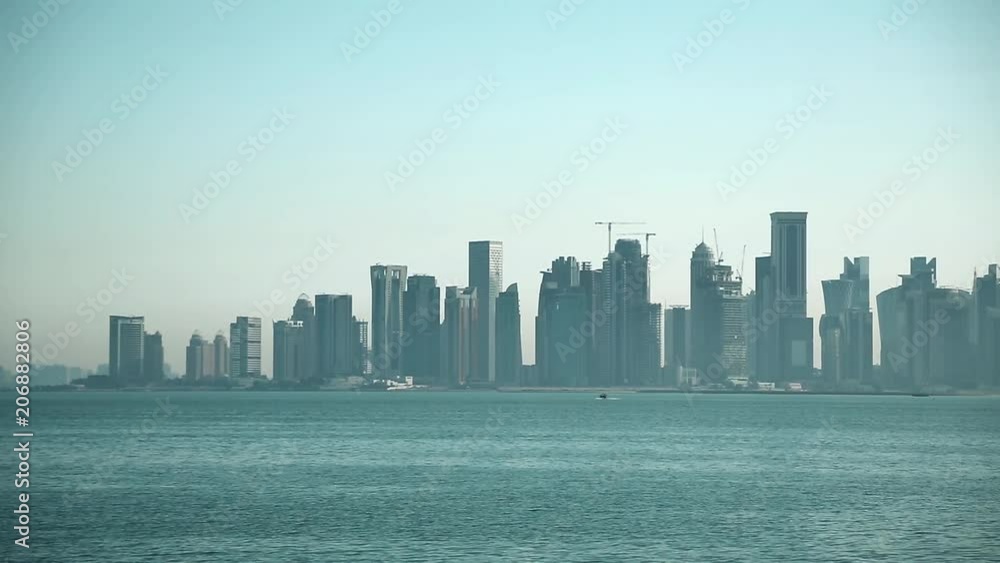 View on skyscrapers in Doha downtown, Qatar, Persian Gulf, Arabian Peninsula. Financial centre in Doha - capital and most populous city in Qatar View on skyscrapers in Doha downtown, Qatar, Persian Gulf, Arabian Peninsula. Financial centre in Doha - capital and most populous city in Qatar