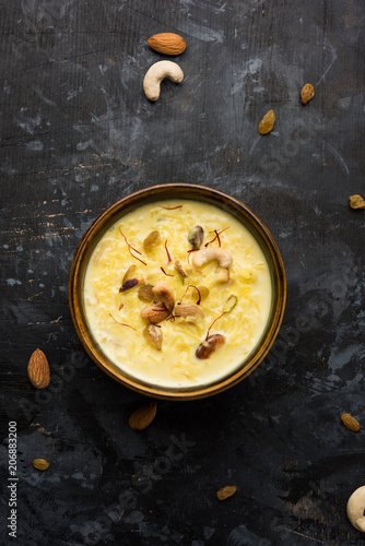 Rice pudding OR Kheer from India called also called Firnee. served in a bowl. Selective focus photo