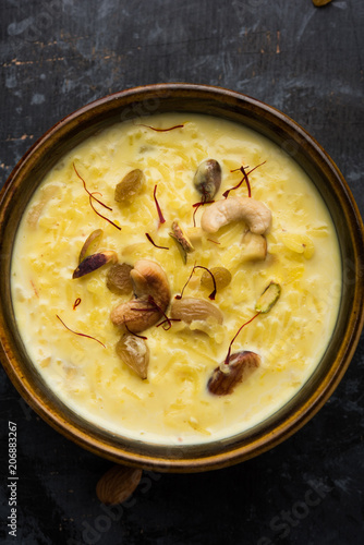 Rice pudding OR Kheer from India called also called Firnee. served in a bowl. Selective focus photo