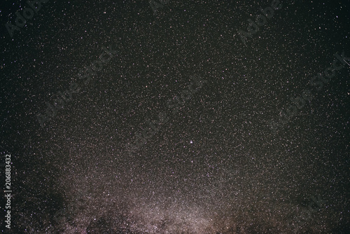 Background of gray starry night sky with the Milky Way