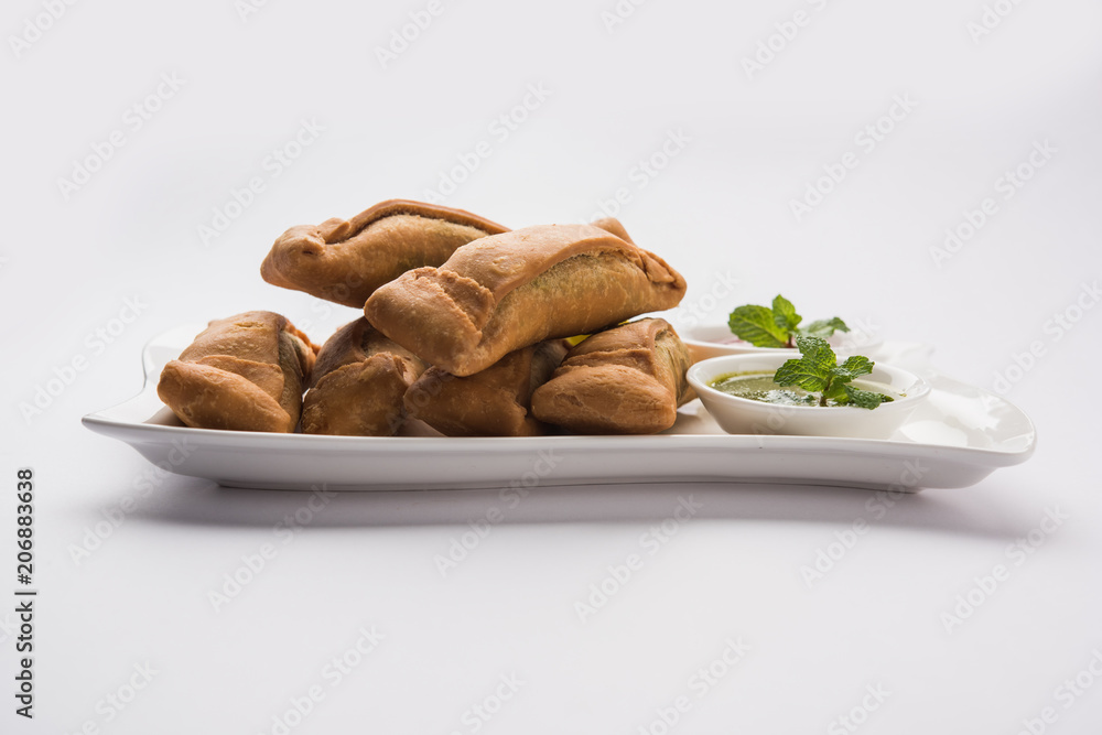 Fototapeta premium Sambar Vadi or Coriander pakora with ketchup and mint chutney