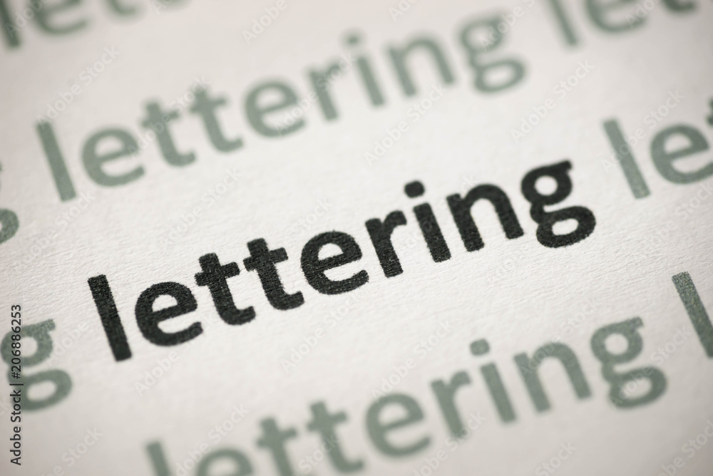 Obraz premium word lettering printed on paper macro