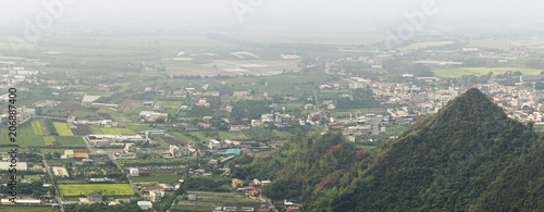 Overlooking farmland and streetscape from Qiwei Mountain in Qishan District, Kaohsiung City, Taiwan. The weather is cloudy and visibility is not good in that day.