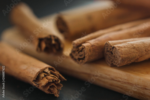 cinnamon sticks, on wooden in rustic style close up
