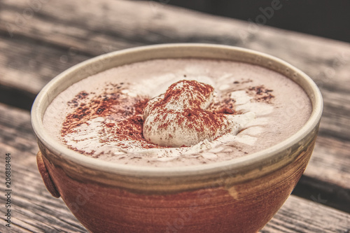 Cup Hot chocolate on an old wood plank photo