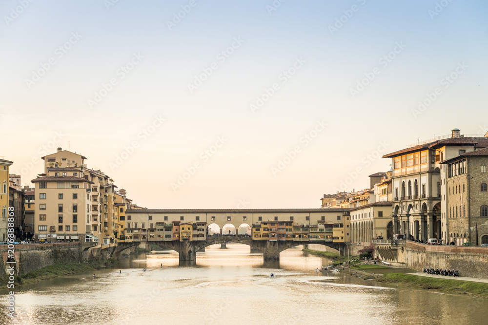 View of the Ponte Vecchio over the Arno River as it passes through Florence