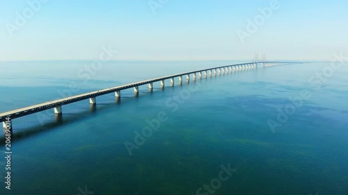 Wallpaper Mural Aerial view of modern Oresund Bridge between Denmark and Sweden (Copenhagen and Malmo), clear blue sky, seascape of Baltic Sea with diagonal composition of very long sea bridge disappearing on horizon Torontodigital.ca