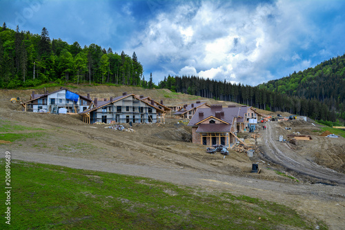 Construction of cottages in the mountains, Carpathians, Ukraine. © Mykola