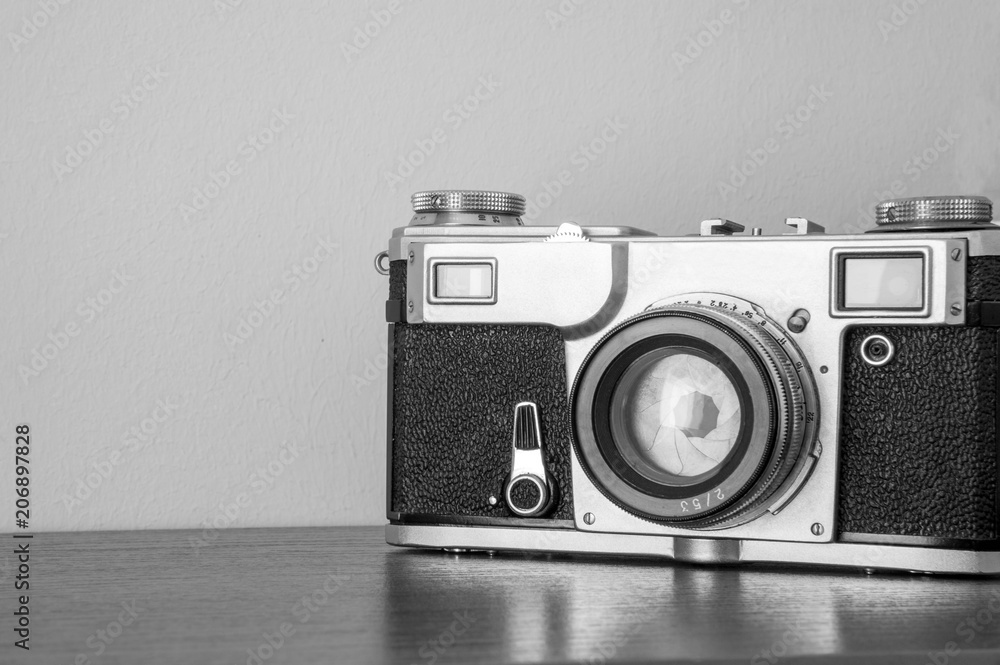 classic camera / classic camera on the shelf on the wall background
