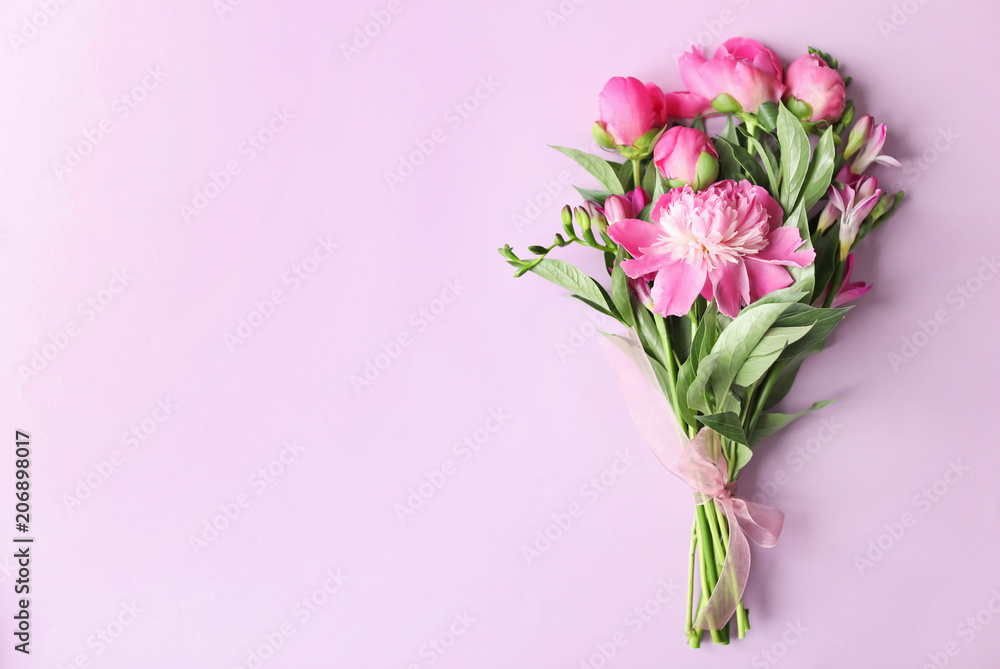 Bouquet of beautiful peony flowers on color background, top view Bouquet of beautiful peony flowers on color background, top view