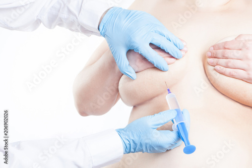 doctor injects into the breast of a woman who is overweight, obese