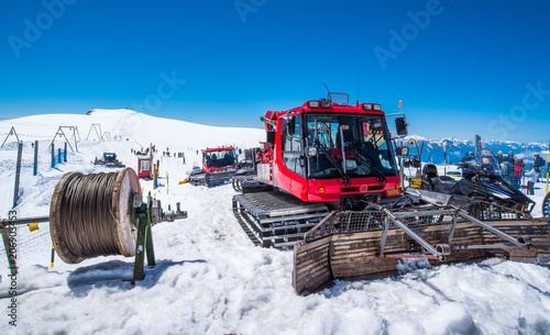 Red snow removal car on the snow mountain