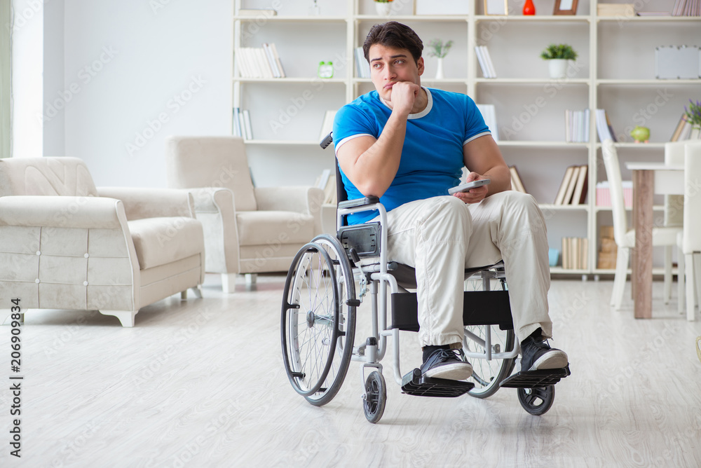 Disabled man watching sports on tv Disabled man watching sports on tv