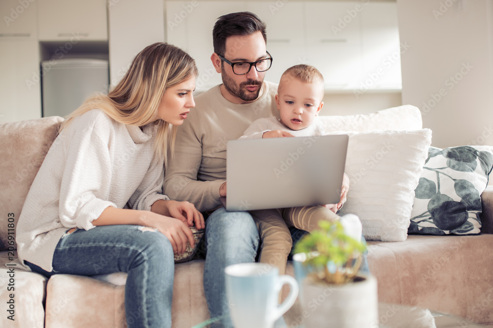 Family using laptop together Family using laptop together