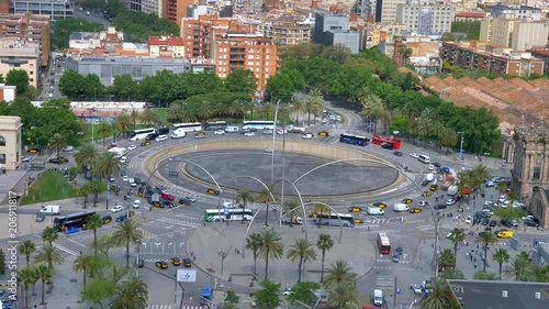 Aerial footage of a large roundabout in downtown Barcelona, with heavy traffic. photo