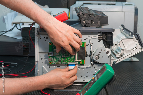 Repair of laser printer, disconnection of wiring ribbon cable.